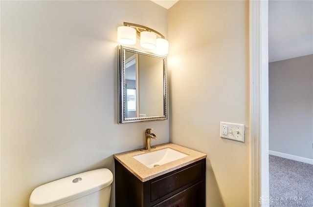 bathroom with toilet and vanity