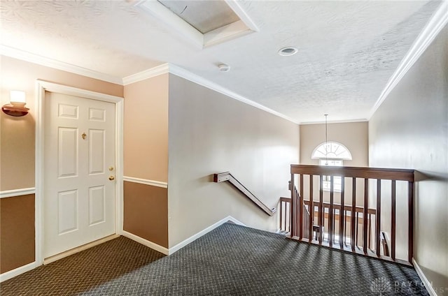 stairway featuring ornamental molding, carpet, a textured ceiling, and baseboards