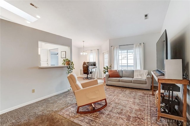 living room with carpet floors, visible vents, baseboards, and an inviting chandelier