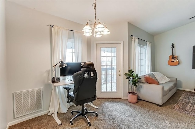 office featuring carpet floors, an inviting chandelier, baseboards, and visible vents