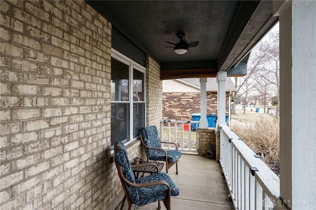 balcony with ceiling fan and a porch