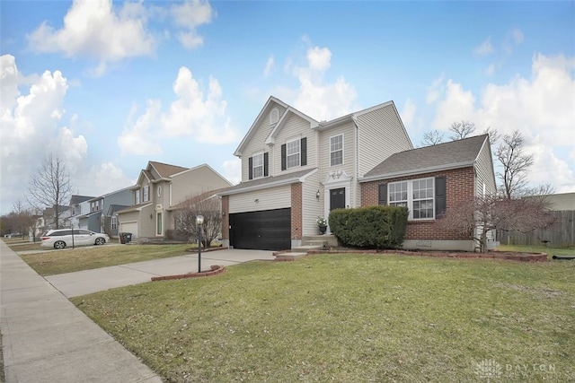 traditional-style house featuring an attached garage, concrete driveway, brick siding, and a front yard