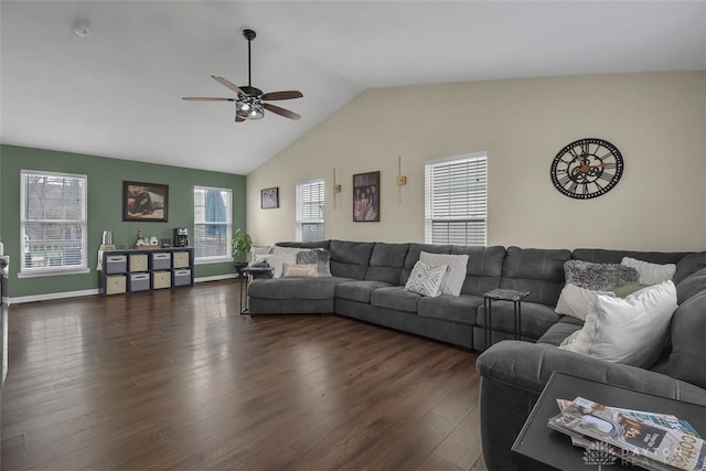 living area featuring dark wood-style floors, lofted ceiling, a ceiling fan, and baseboards