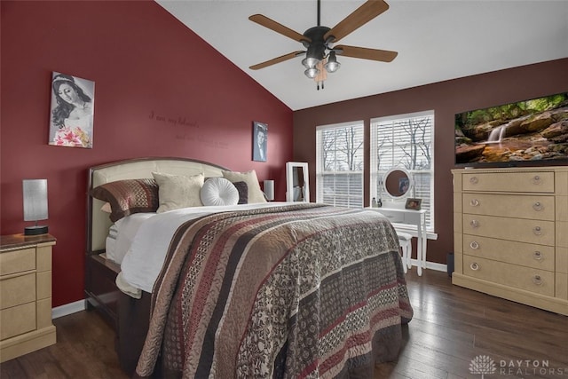 bedroom with lofted ceiling, dark wood-type flooring, and baseboards