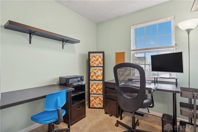 home office with light carpet and a textured ceiling