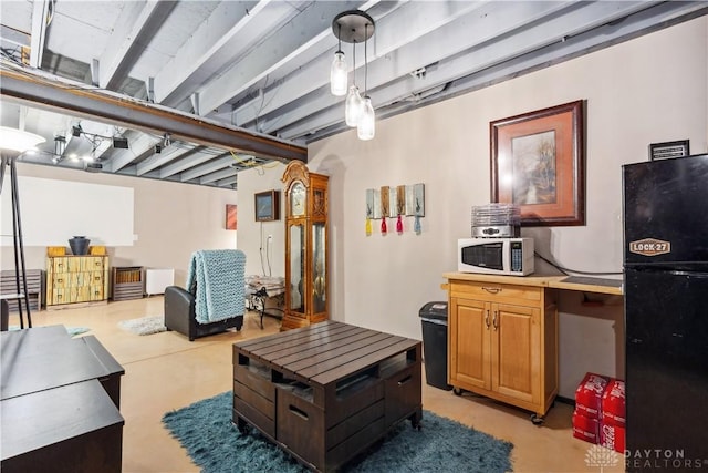 living area with concrete floors