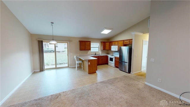 kitchen with light countertops, light colored carpet, brown cabinetry, white appliances, and baseboards