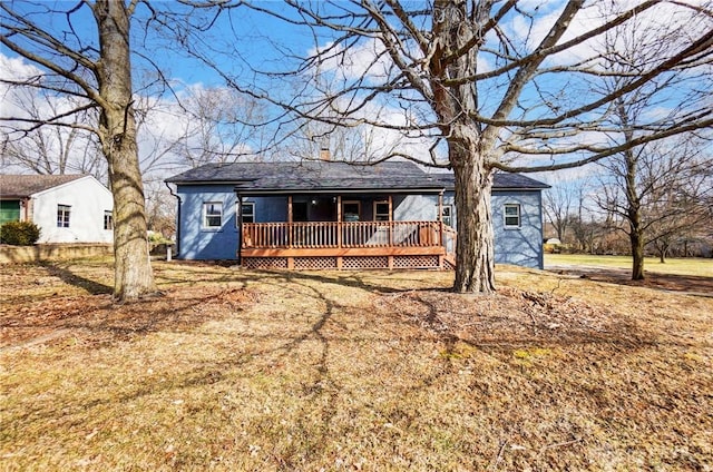 ranch-style home featuring a wooden deck