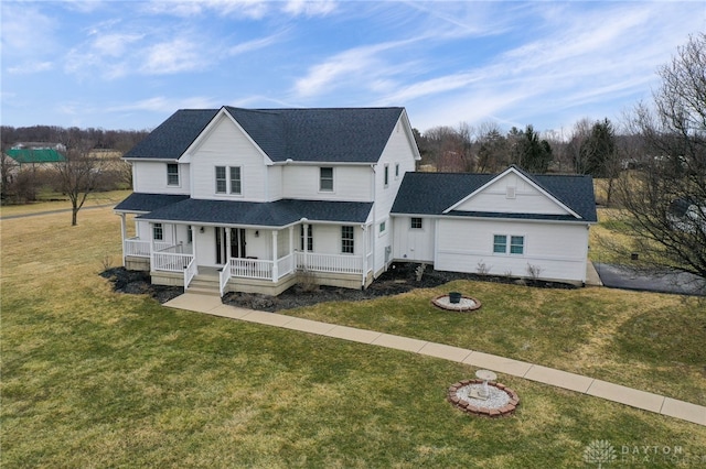 view of front of house featuring a porch, a front lawn, and roof with shingles