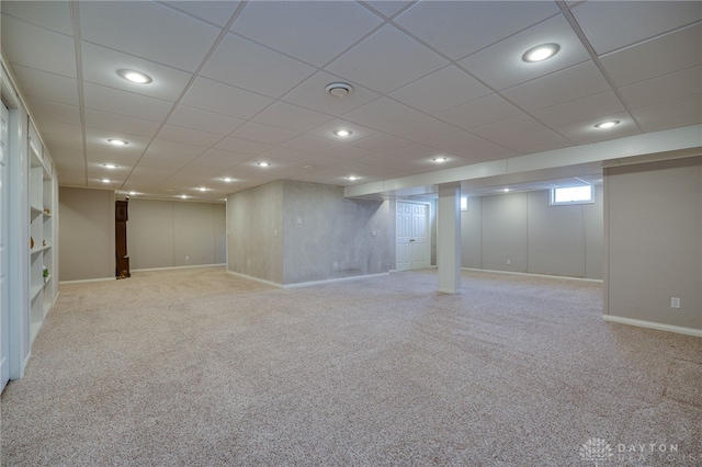 basement featuring baseboards, carpet floors, and recessed lighting