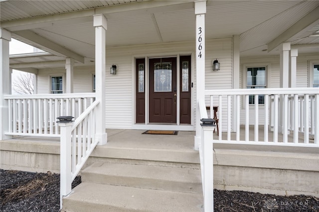 doorway to property featuring covered porch