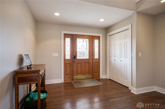 entryway featuring recessed lighting, dark wood-style flooring, and baseboards