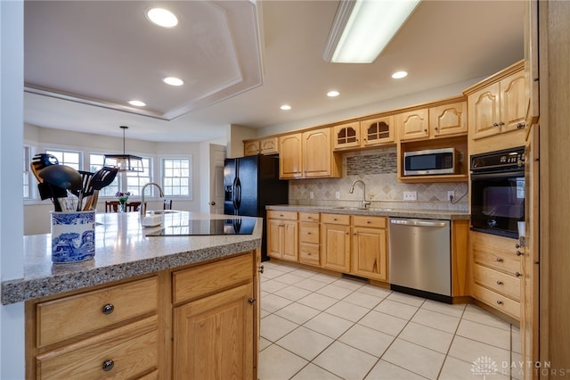 kitchen with light brown cabinets, backsplash, black appliances, and light tile patterned floors