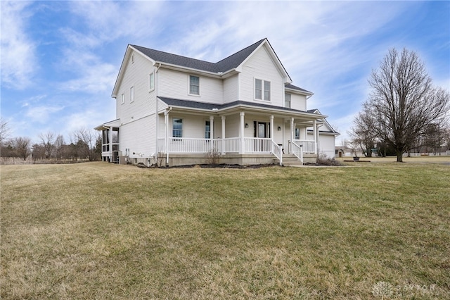 view of front of property with a porch and a front lawn