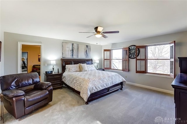 bedroom with light carpet, ceiling fan, and baseboards