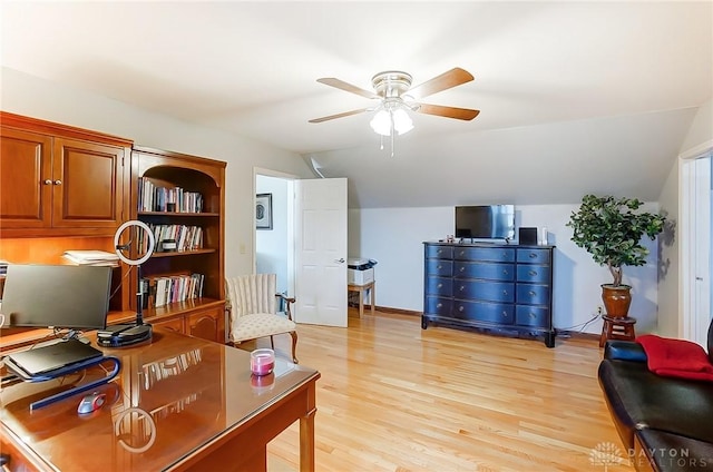 office area with lofted ceiling, light wood-style floors, baseboards, and a ceiling fan