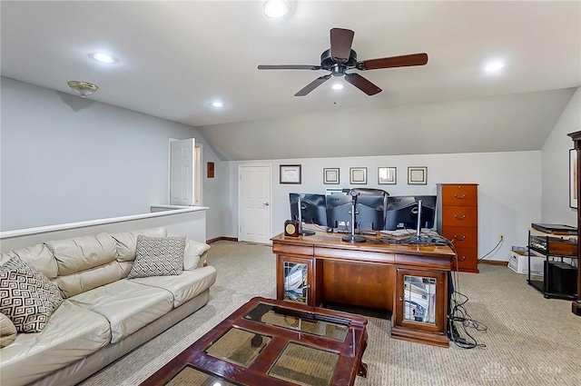 office area with baseboards, vaulted ceiling, and light colored carpet