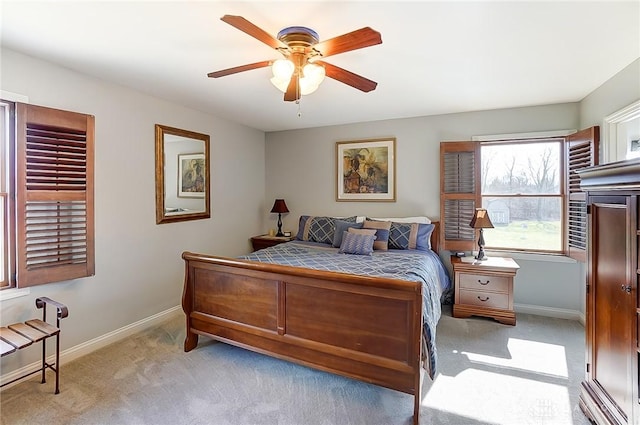 bedroom with carpet flooring, a ceiling fan, and baseboards