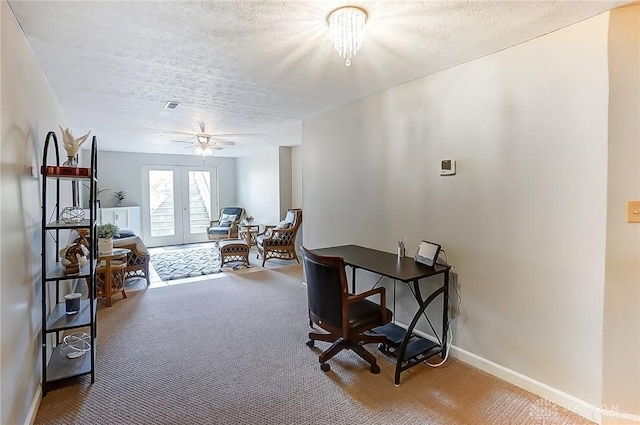 office area with a textured ceiling, french doors, carpet, and baseboards