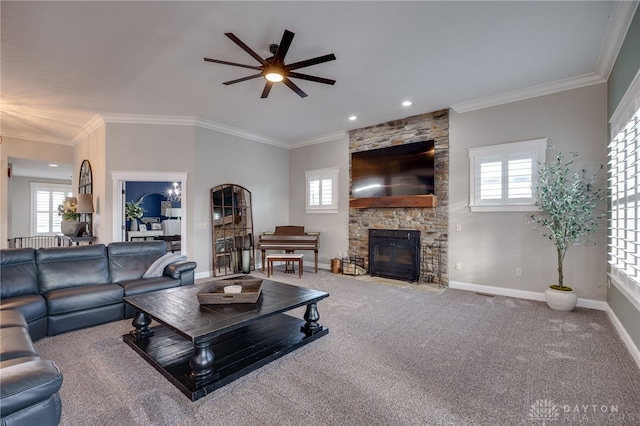 living area with carpet, crown molding, a stone fireplace, and baseboards