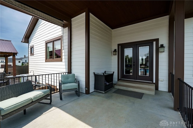 view of exterior entry featuring french doors