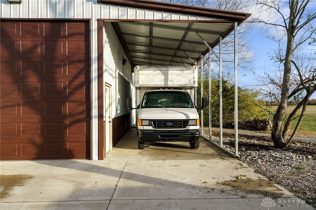 view of parking featuring concrete driveway