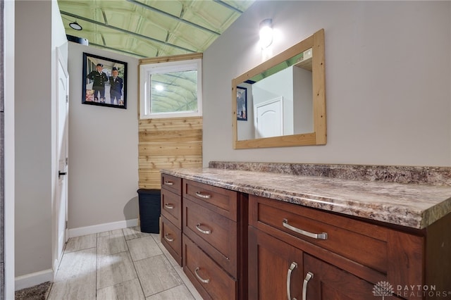 bathroom with vanity and baseboards