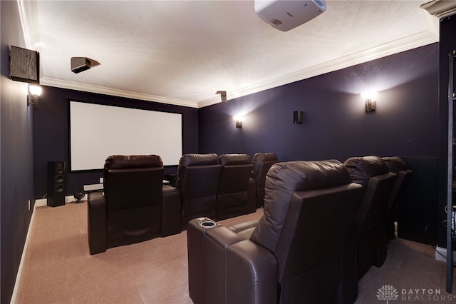 carpeted cinema room with a textured ceiling and ornamental molding