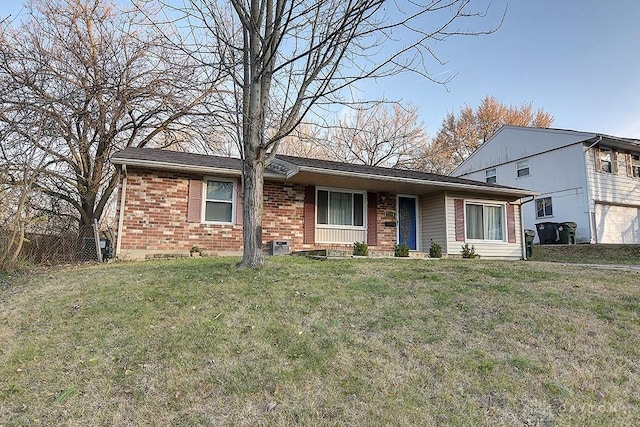 ranch-style home with brick siding and a front lawn