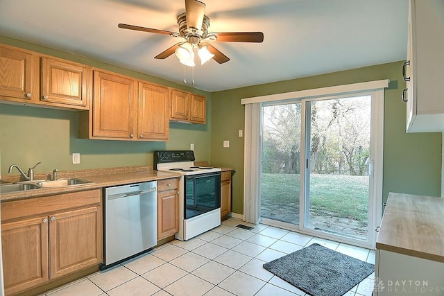 kitchen with light tile patterned flooring, white electric range, a sink, a ceiling fan, and dishwasher