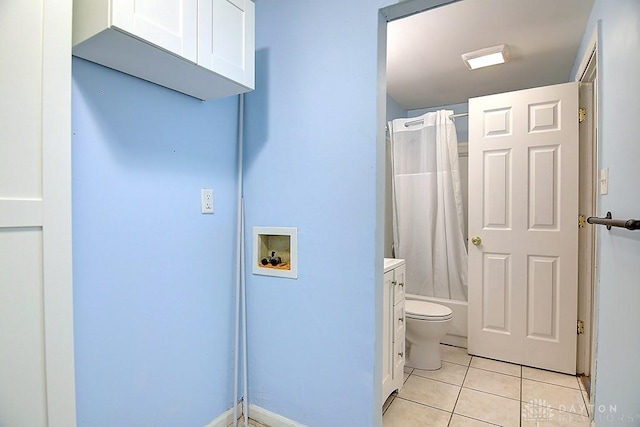 bathroom with tile patterned flooring, toilet, and shower / bath combo with shower curtain