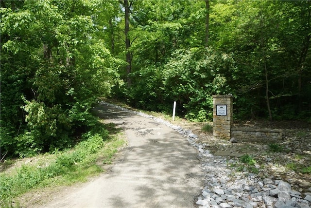 view of street featuring a forest view