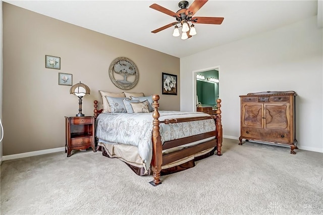 bedroom with a ceiling fan, light colored carpet, and baseboards