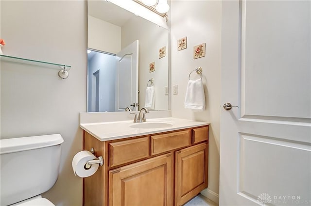 half bath with vanity and toilet