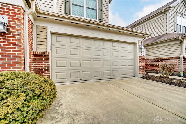 garage featuring driveway