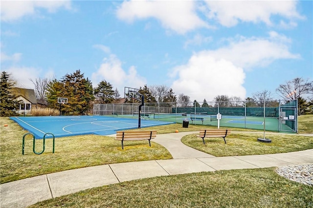 view of basketball court featuring a tennis court, community basketball court, a yard, and fence