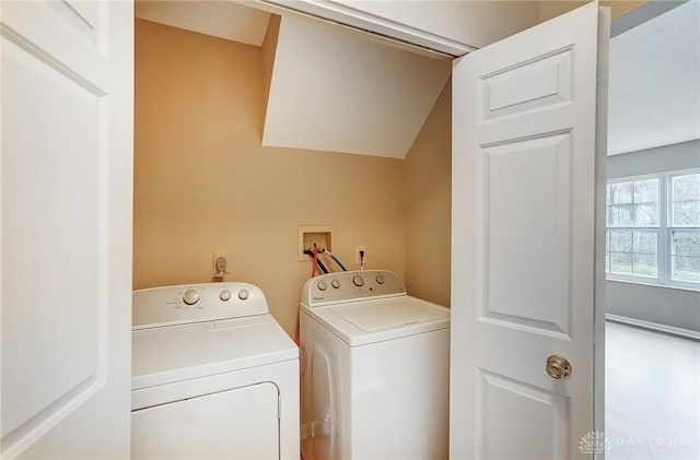 clothes washing area featuring laundry area and washing machine and clothes dryer