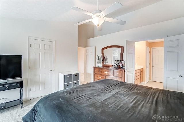 bedroom featuring light carpet, ceiling fan, and vaulted ceiling