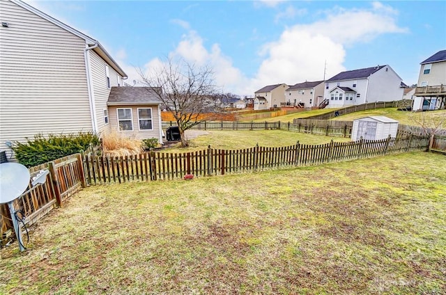 view of yard with a fenced backyard and a residential view