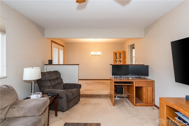 living area with light carpet, baseboards, and a notable chandelier