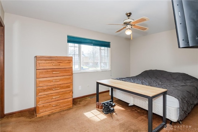 carpeted bedroom featuring baseboards