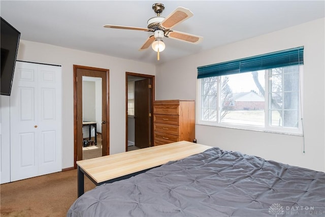 bedroom with a closet, carpet, and a ceiling fan