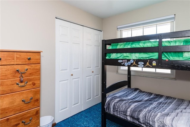 bedroom with carpet floors and a closet