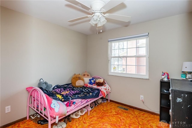 bedroom featuring visible vents, baseboards, and ceiling fan