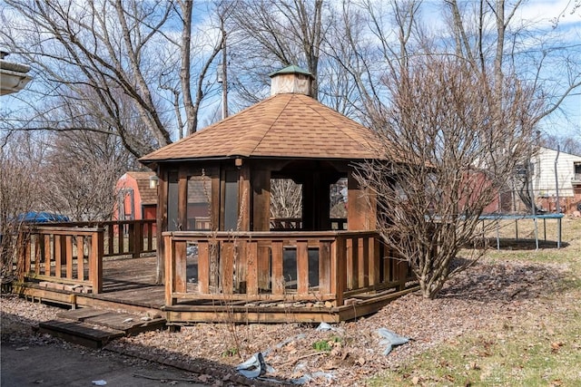 deck featuring a trampoline and a gazebo