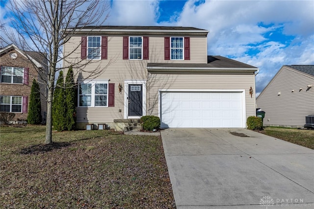 view of front of house with a garage, a front yard, and driveway