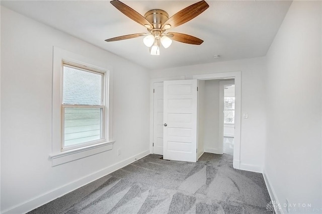 unfurnished bedroom with carpet flooring, ceiling fan, and baseboards