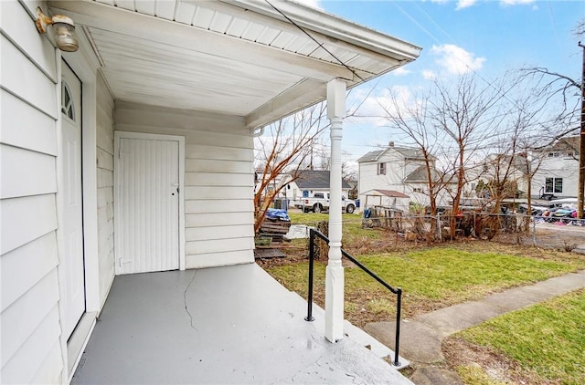 view of patio with a residential view and fence