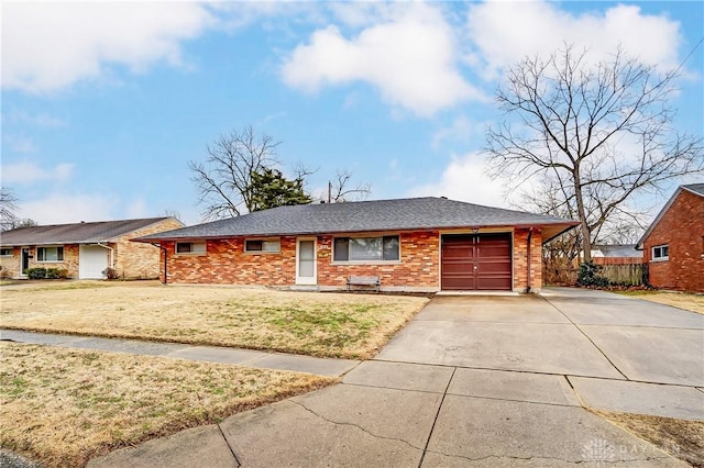 single story home with an attached garage, brick siding, a shingled roof, driveway, and a front yard