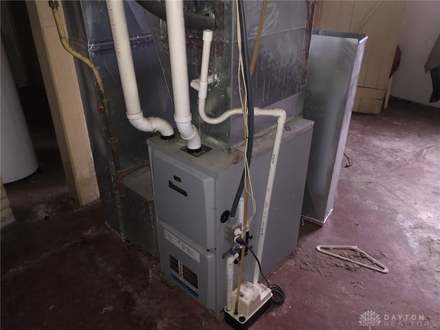 utility room featuring heating unit